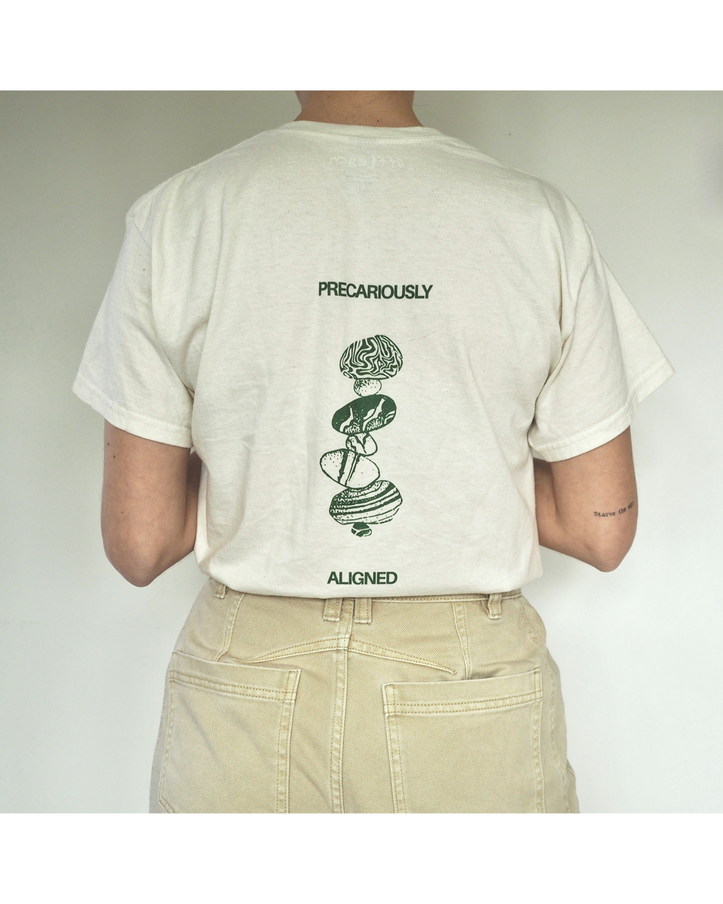 'Precariously Aligned' unisex cotton tee