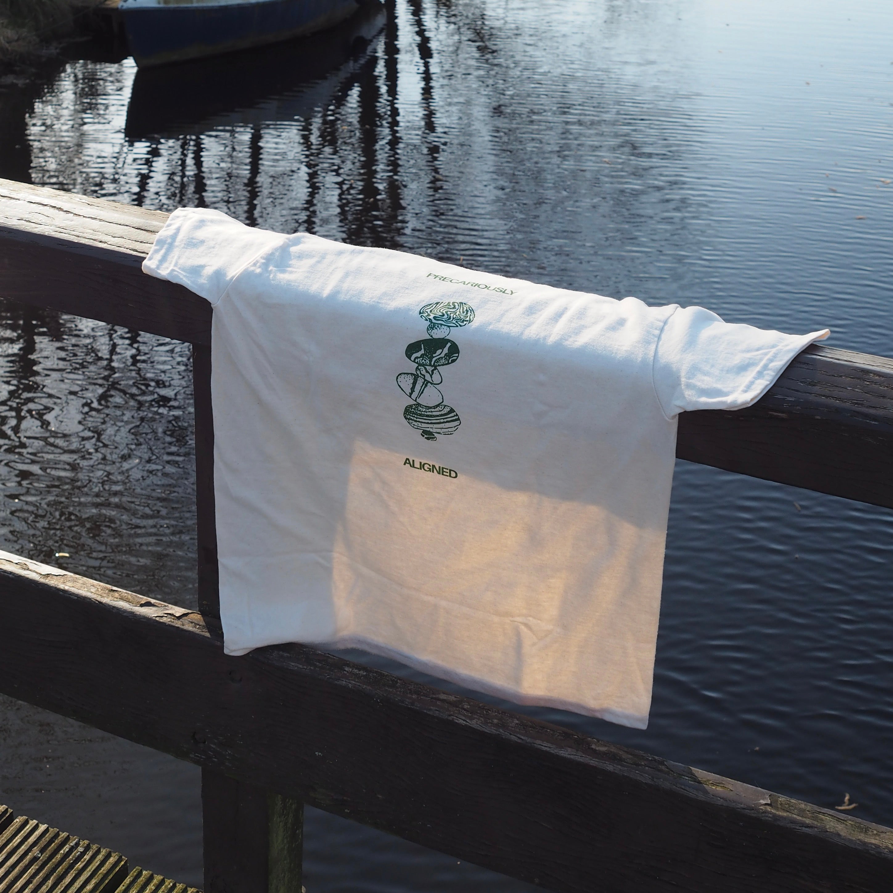 'Precariously Aligned' unisex cotton tee